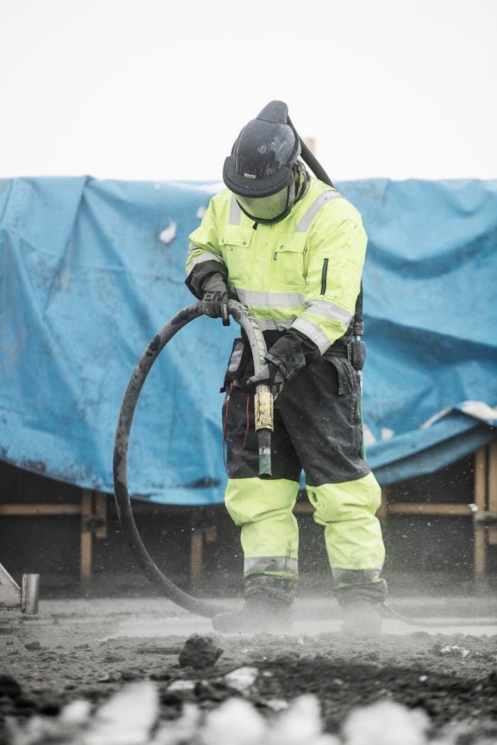 Mastering the First Impression: Your intriguing post title goes here Construction worker operating heavy machinery at a building site, ensuring safety and precision.